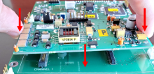 Gripping the GHA-472 board on the short sides with thumb and forefinger, gently press down to reseat the GHA-472 board onto the pin connectors on the PRCB-472 board