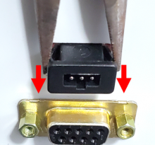 The old charging port is pulled out of the charger body