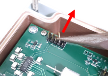 To remove the spare RS-232 pins, use pliers to bend pins back and forth until they break