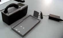 Aspect MKC-A03 RID, alongside the docking station and power cord