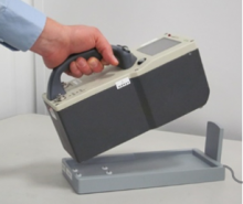 Placing Aspect MKC-A03 on docking station