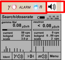Alarm indications in the screen, and the gamma and neutron alarm lights on the instrument body