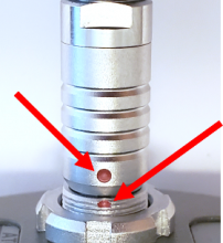 Align the red dots of the connector and plug