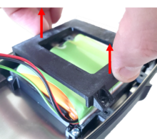 Battery holder removed over battery inside BT-DU3